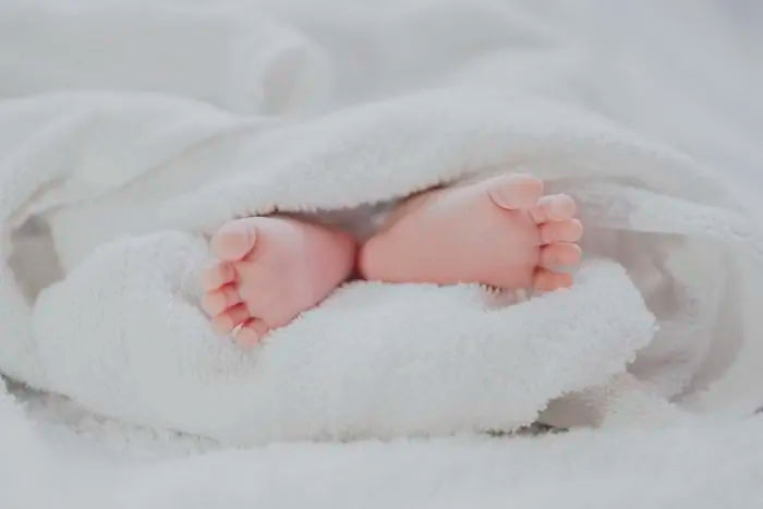 Baby with milestone frame